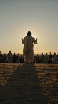 Jesus delivering sermon to crowd at sunset outdoors, vertical footage