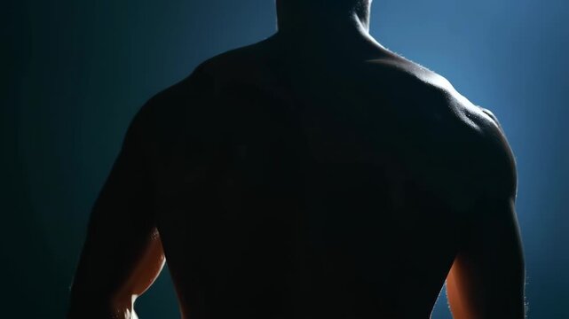 Runner muscular back in slow motion with cinematic lighting effects featuring fitness, athlete, sports with action and movement elements for energy,