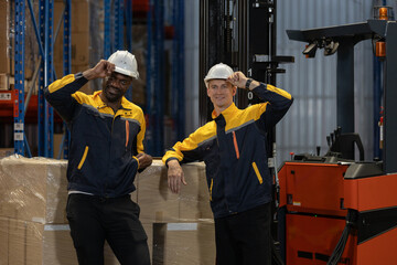 Warehouse workers posing with forklift in storage facility, professional industrial staff and logistics team, workforce concept in supply chain operation, teamwork and employee portrait in warehouse. © eakgrungenerd