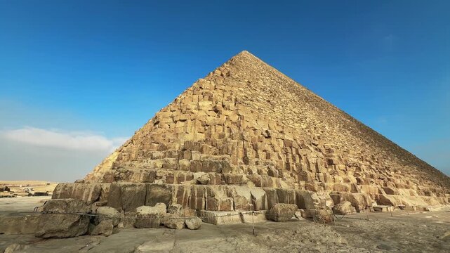Great Pyramid of Khufu Rising from the Desert at Giza Necropolis against Vivid Blue Sky