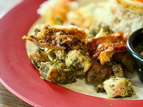 Filipino pork silog served with fragrant cilantro rice, spicy sambal, and sunny side up fried egg. A hearty and flavorful comfort food dish, perfect for breakfast, brunch, or casual dining content. C