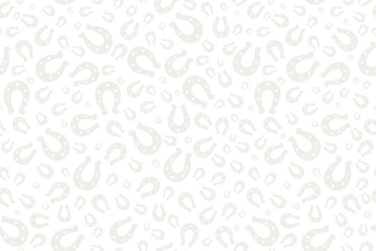 Cloudy and white silhouette of a lucky horseshoe. Seamless horizontal vector pattern. Endless animal print. Isolated colorless background. White horse shoes. St. Patrick's Day. Flat style. 