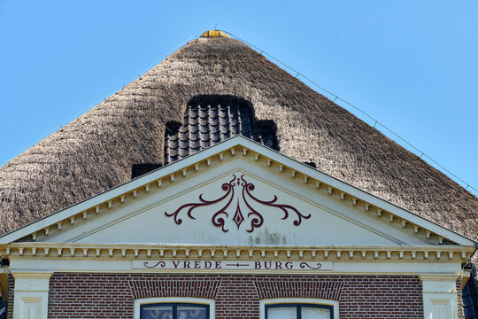 Traditional Architecture And Cultural Heritage Close-Up Of A Thatched Roof Former Farmstead House In Limmen Noord-Holland Netherlands Ornate Details And Historic Charm