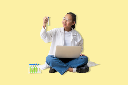 Young girl scientist in a lab coat is intently analyzing test tubes and recording data onto a laptop, smiling. The background is translucent. Transparent background