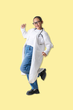 Joyful young woman  dressed as a doctor jumps with excitement, symbolizing confidence, positivity, and happiness in a healthcare or educational concept