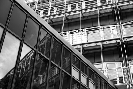 Industrial monochrome facade architecture in exterior view with glass steel structure and hard lines shown in perspective for an abstract modern building detail