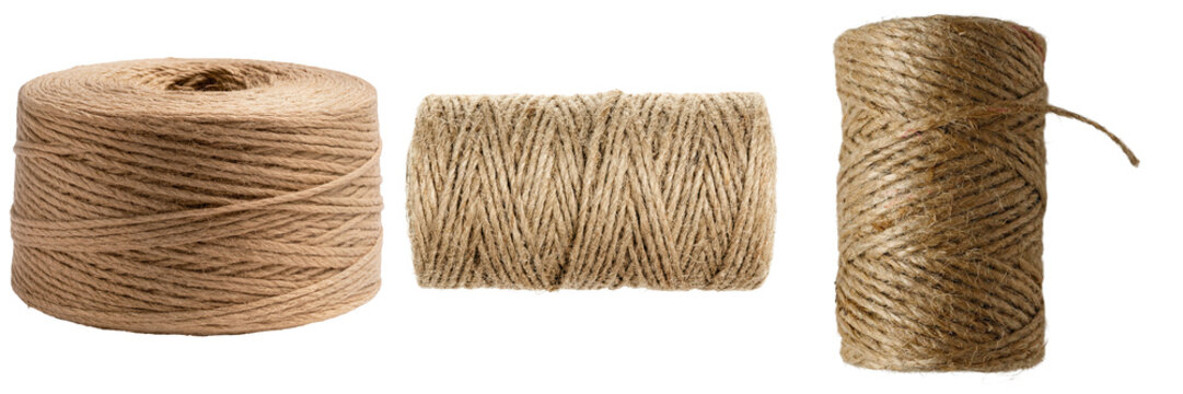 Natural jute twine spools, essential for crafting, gift packaging, and rustic decor, isolated on transparent background.