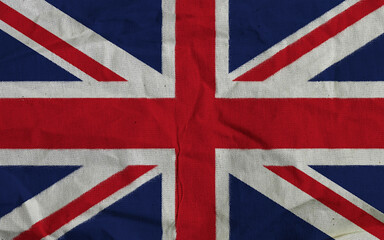 Fototapeta premium Vintage Union Jack Fabric Flag Of The United Kingdom With Worn Texture And Folded Details