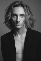 Boy with long blond hair. handsome young Man with trendy Hairstyle © eugenepartyzan