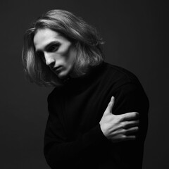 Boy with long hair. handsome young Man with trendy Hairstyle © eugenepartyzan