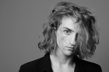 Boy with long blond hair. handsome young Man with trendy Hairstyle © eugenepartyzan