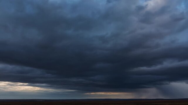 Dramatic cloud formations over a vast landscape at dusk. Capturing the beauty and intensity of nature's weather patterns