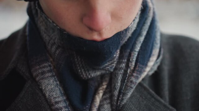 Creator adjusting scarf and watch, closeup hands, wool scarf, dark coat, muted winter street, slow deliberate motions, tactile textures, luxury watch reveal, cinematic shallow focus