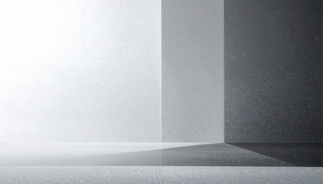Fond de studio moderne avec une architecture g&eacute;om&eacute;trique &eacute;pur&eacute;e et des ombres douces sur des surfaces grises textur&eacute;es pour un design contemporain.