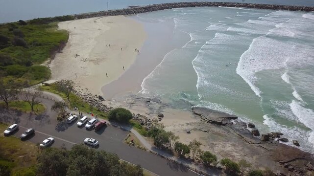 Turners Beach sits on the Eastern Australian coastline near the town of Yamba and houses many surfers as they get a salty taste of the South Pacific Ocean. The Yamba Breakwater divides the sea water.
