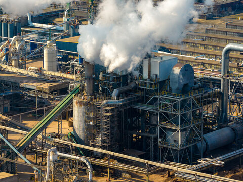 Aerial view of Industrial wood factory manufacturing or recycling wood products, contributing to pollution from its facilities, Grajewo, Podlaskie Voivodeship, Poland.