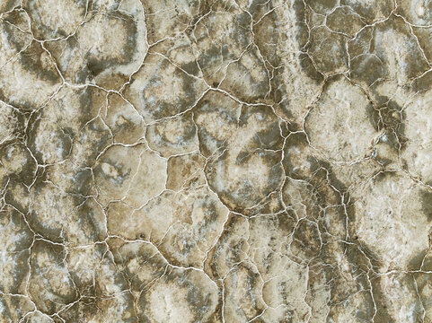 Aerial view of a parched earth, cracked and dry, resembling an abstract painting of beige and brown hues, Walvis Bay, Erongo Region, Namibia.