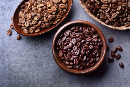 various coffee beans in wooden bowls