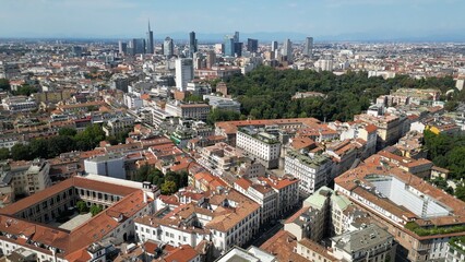 Fototapeta premium Europe, Italy, MIlan 03,30,2026 drone aerial view of Milan downtown fashion district , Corso Venezia , natural history museum and new skyline with skyscrapers in Gea Aulenti Garibladi 