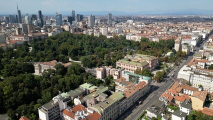 Fototapeta premium Europe, Italy, MIlan 03,30,2026 drone aerial view of Milan downtown fashion district , Corso Venezia , natural history museum and new skyline with skyscrapers in Gea Aulenti Garibladi 