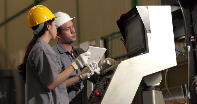 Technicians monitor a CNC machining process inside the machine enclosure during production setup, highlighting inspection, workflow control, and precision manufacturing.

