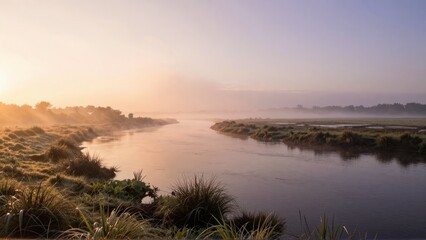 Fototapeta premium Winding River at Sunrise with Mist and Golden Light - Nature Photography