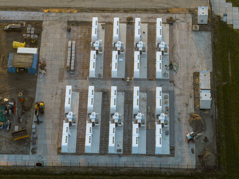 Aerial view of energy storage units supporting sustainable integration of renewable wind power into the grid, promoting green energy solutions