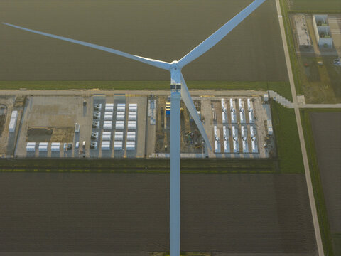 Aerial view of wind turbine power plant storing renewable energy in netherlands