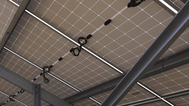 Backside of solar panels showing electrical wiring connections