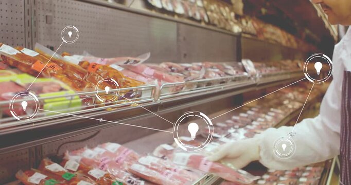 Grocery employee responding to animated nodes, reaching into fridge shelf and organizing meat packs
