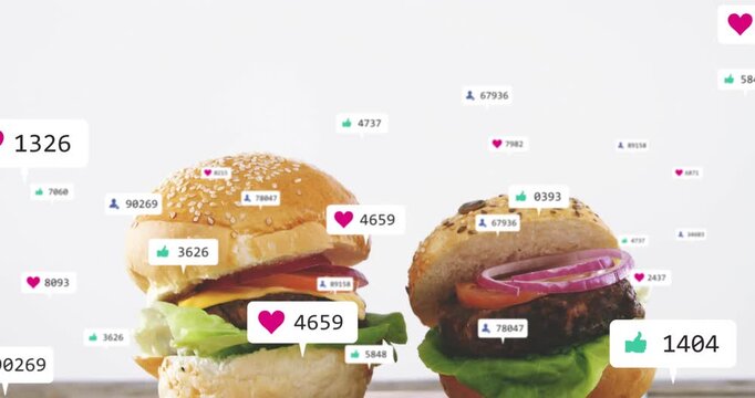 Two burgers resting on blue plate while camera moving down and marketing labels rising near buns