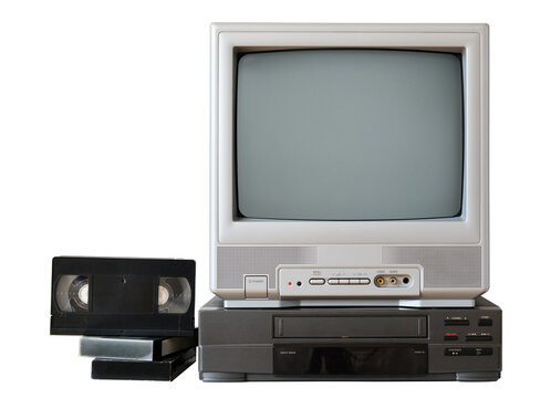 Vintage TV set with video player and VHS cassettes on white background.