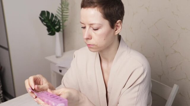 cancer patient takes a pill and drinks water, endocrine therapy medication adherence at home