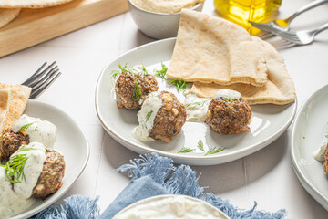 Greek lamb meatballs. Mediterranean food with tzatziki sauce © Jeremy Pawlowski