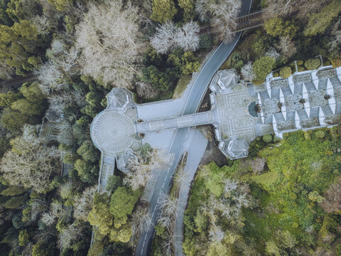 Aerial view of the Bom Jesus do Monte sanctuary's elaborate staircases and serene gardens blend ancient architecture with lush nature, Braga, Braga, Portugal.