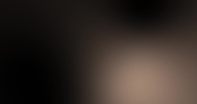 Black dark brown beige abstract background. Smooth neutral gradient ombre blend with soft shadow tones. Blurred background moving in gentle color transitions, subtle glowing light backdrop. Seamless