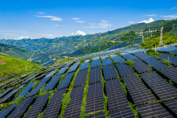 Large-scale solar farm and photovoltaic power station on mountain slopes for renewable energy production © ABCDstock