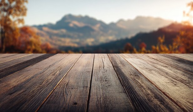 Close-up view of wooden planks with blurred mountain landscape in background at dusk