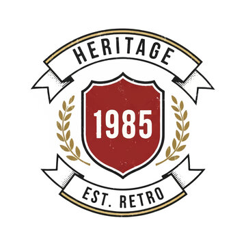 Heritage emblem crest featuring shield, laurel leaves and ribbon banner with 1985.