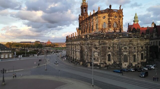 Slow sunset push toward Semperoper facade and rooftop statues