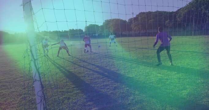 Sports striker receiving ball outside box and dribbling past defenders toward goal aiming low shot