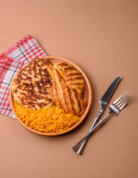 Dajaj Mashwi, an Arabic dish with rice and chicken, salt, and spices. Dajaj Mashwi as a background