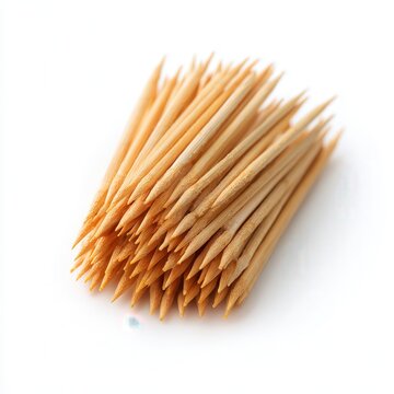 Macro wooden toothpicks bundle, sharp pointed bamboo sticks on white background, clean minimal kitchen hygiene concept
