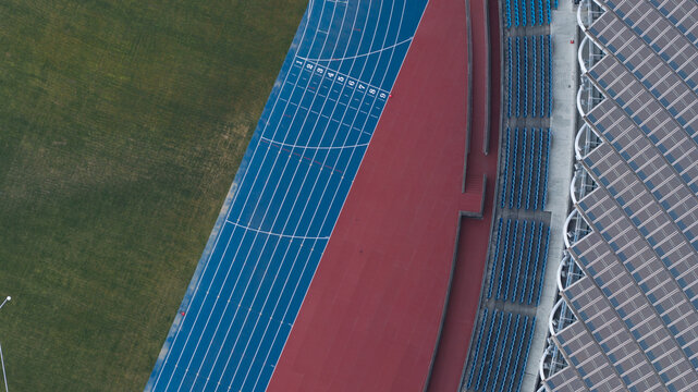 Aerial view of the blue running track and solar panel roof at the Kaohsiung National Stadium in Fuxingli, Kaohsiung City, Taiwan.