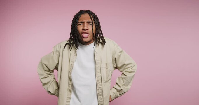 Expressive moments of a young man showcasing a range of emotions in a colorful studio setting