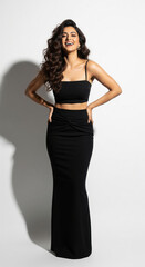 Fototapeta premium Smiling Indian Woman Posing in Elegant Black Outfit