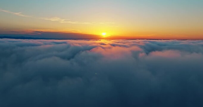 Beautiful aerial panorama above clouds bright sun flare clear sky. High altitude drone flight sunset heaven view. Peaceful nature beauty meditation spiritual journey inspiration concept footage.