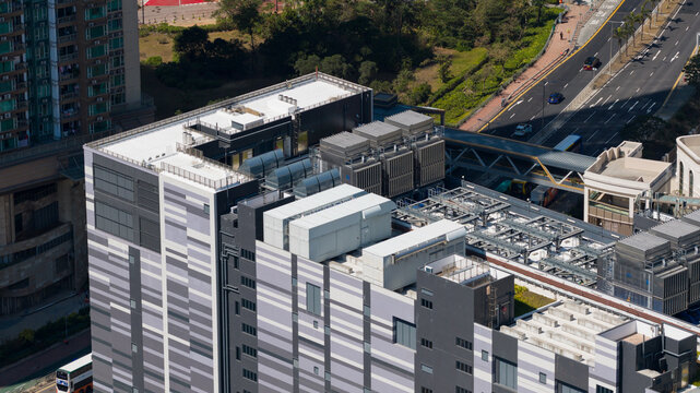 Aerial view of Equinix Data Center featuring rooftop cooling units and modern facade architecture in Tseung Kwan O, New Territories, Hong Kong.