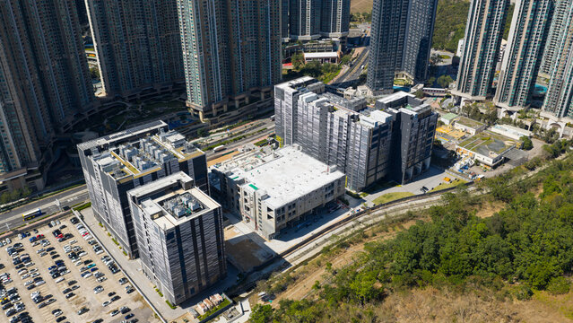 Aerial view of Equinix Data Center surrounded by modern high-rise residential towers and a large parking lot in Tseung Kwan O, New Territories, Hong Kong.