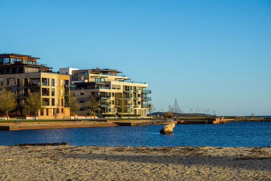 Modern Waterfront Apartments and Sandy Beach in Kristiansand Norway Featuring Contemporary Scandinavian Residential Architecture and Coastal Urban Living